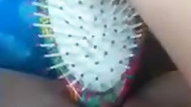 Teen fucking herself with hairbrush