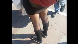 Teen girl in shiny black pantyhose