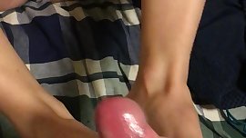 Sexy teen feet jerking load out of hard cock. Incredible footjob w/ cumshot
