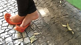 Candid girl feet in street