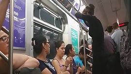 Hot teen rubs tits on train pole